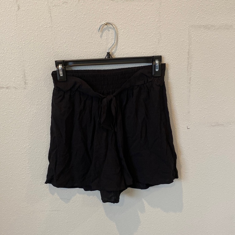 Happening in the present, black tie shorts